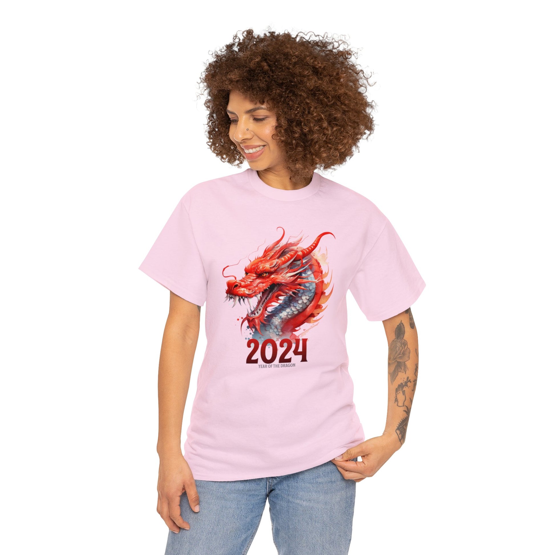 Light pink color 2024 year of the dragon t-shirt with watercolor Chinese style dragon with 2024 underneath and in small writing year of the dragon under the 2024.  Design fills front of shirt. worn by woman