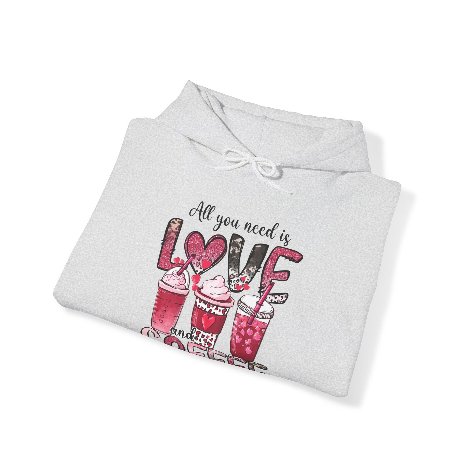 Ash colored hooded graphic sweatshirt with coffee graphic on front.  Three different style of coffees and the words "All You Need is Love and Coffee".  Back of sweatshirt is plain , no graphic.