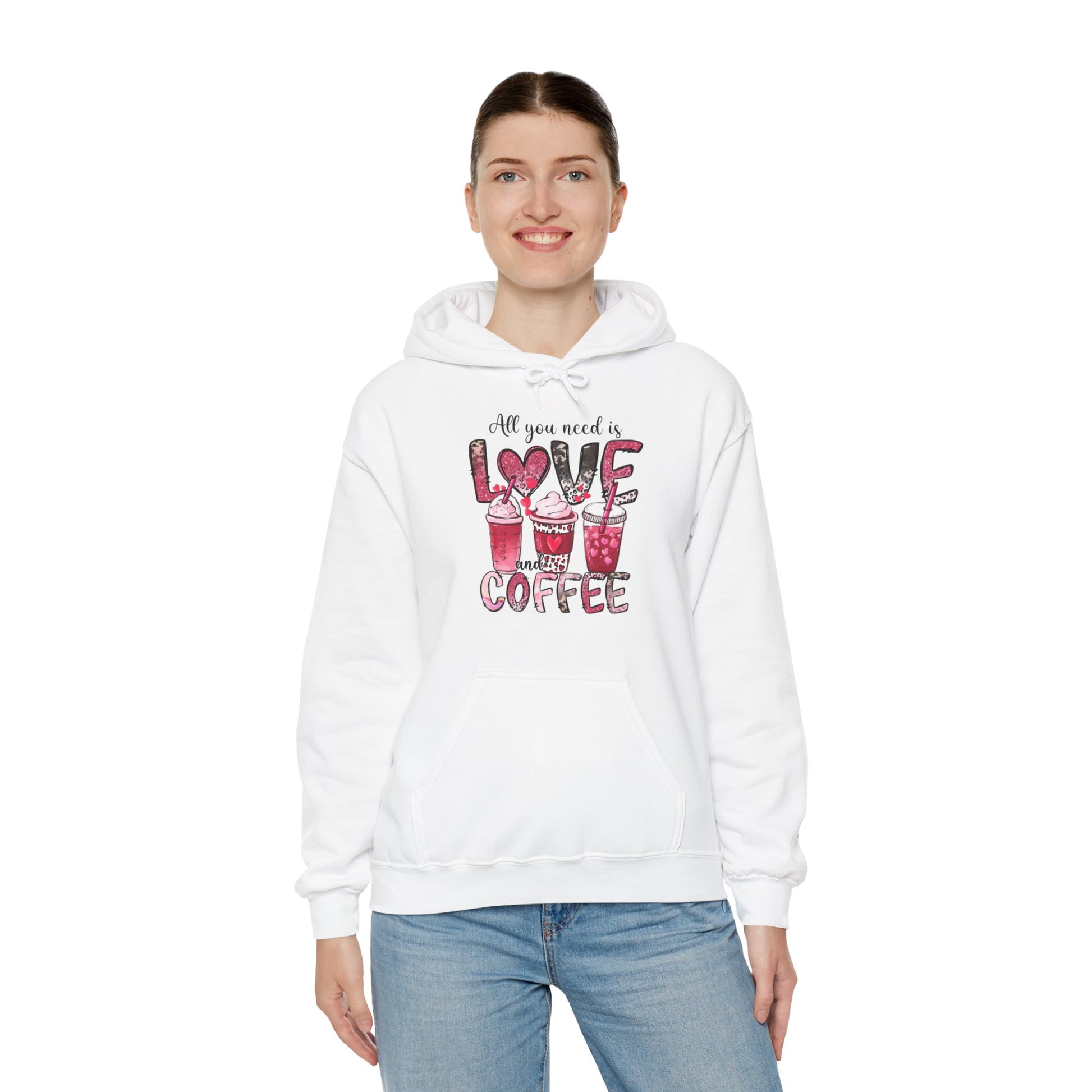 White hooded graphic sweatshirt with coffee graphic on front.  Three different style of coffees and the words "All You Need is Love and Coffee".  Back of sweatshirt is plain , no graphic. Woman model