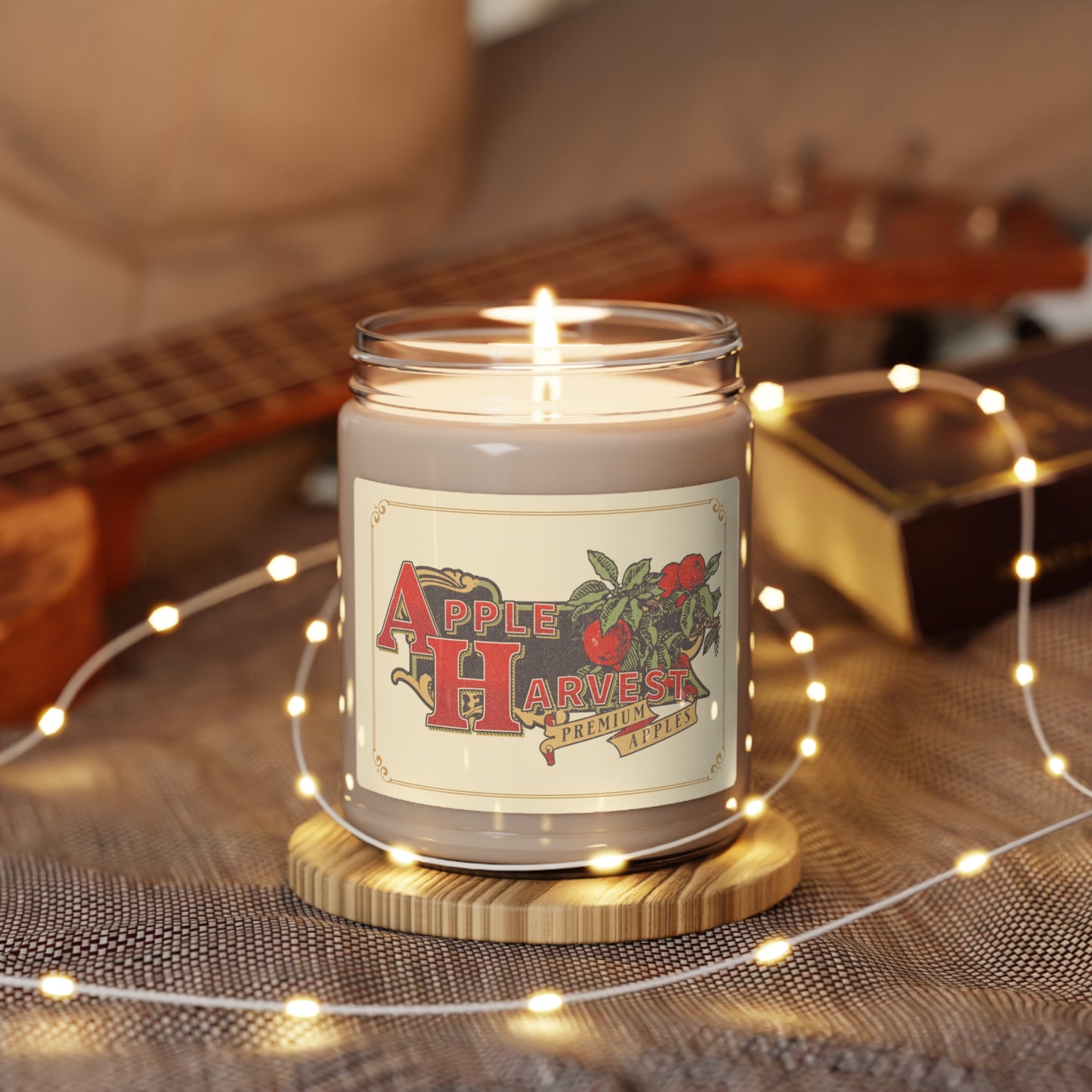 Apple Harvest lit 9 oz soy candle surrounded by pixie lights