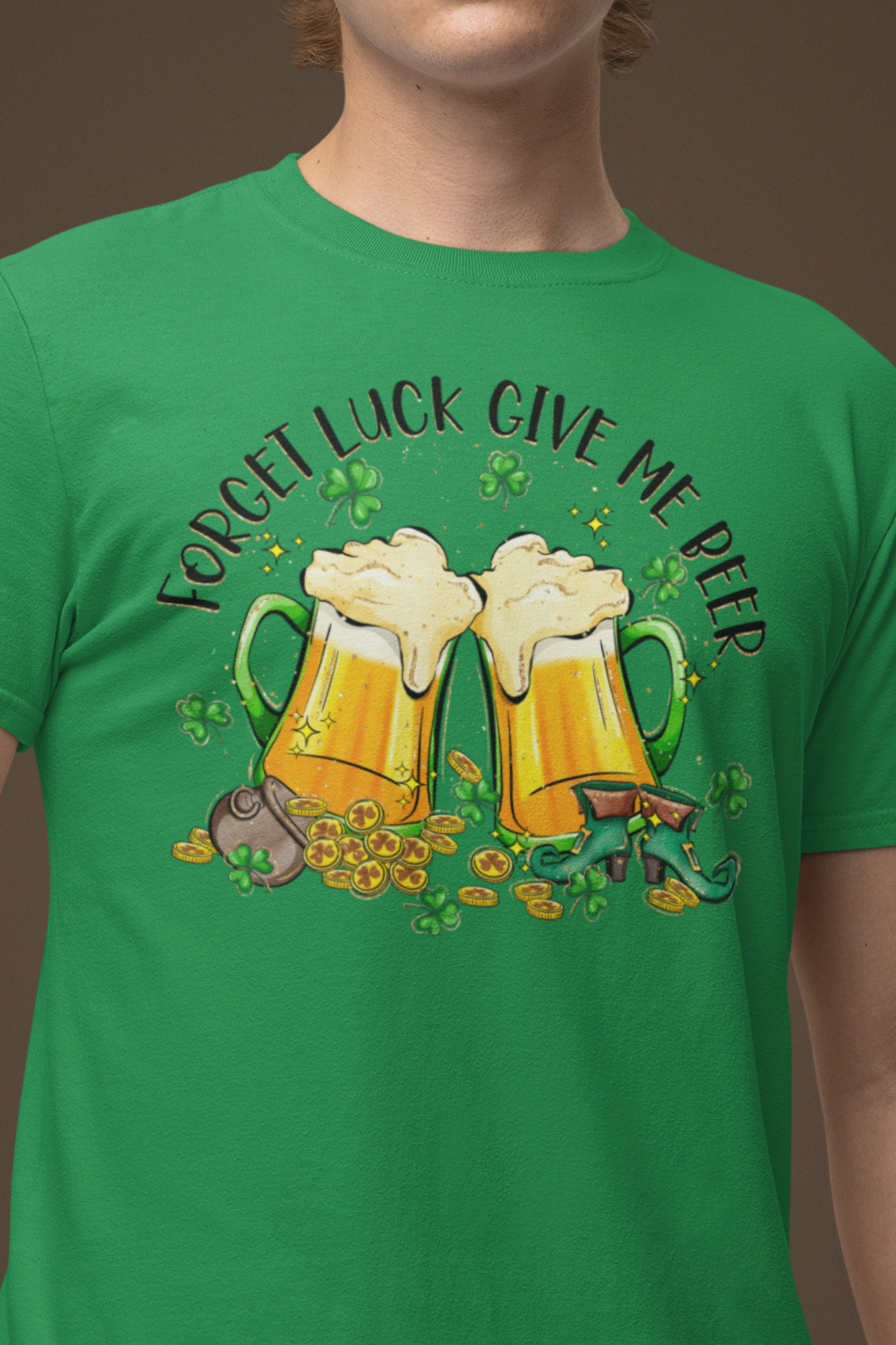 Irish Green color St. Patrick's Day T-Shirt with two beer mugs toasting each other surrounded by shamrocks sitting on a spilled pot of gold coins and a pair of leprechaun boots.  Shirt declares "Forget Luck Give Me Beer" arched above beer mug graphic Male Mock up