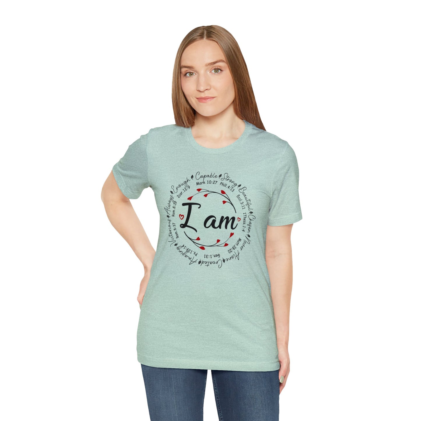 Heather Prism Mint color graphic t-shirt with "I Am" in the middle"  Surrounded by branches with hearts as the buds then further surrounded on the outside of the circle the words "Capable, strong, beautiful, chosen, Never Alone, Created, Amazing, Victorious, Always, Enough" with corresponding bible verse references under each word.  Graphic is on the front and the back is plain, no graphic. Modeled by Woman