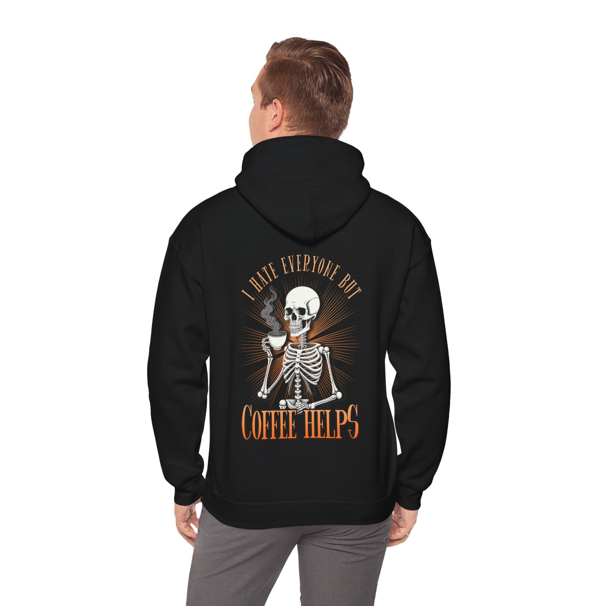 Black colored hoodie sweatshirt with graphic on front and back.  Front has a skeleton head on the left hand side picket area.  The back has a skeleton waist up drinking a cup of coffee that says "I Hate Everyone But Coffee Helps"  Male modeling back