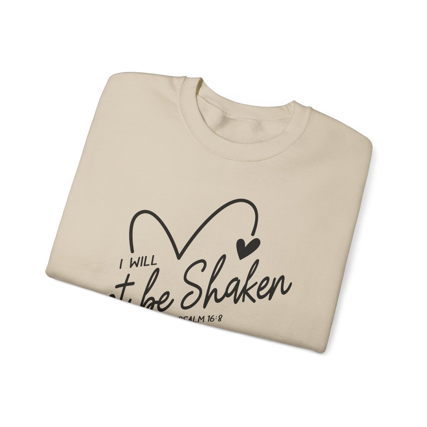 Sand Color folded Crewneck sweatshirt with a drawn heart and the words "I Will Not Be Shaken" Psalm 16:8 on the front 