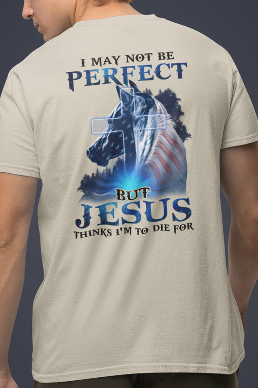 Sand color t-shirt with a horse graphic with an American Flag mane and overlaid with a cross and the words "I may not be perfect" above and "but Jesus Thinks I'm to Die For" on the bottom.  This graphic is printed on the back and the front is plain, no graphic.