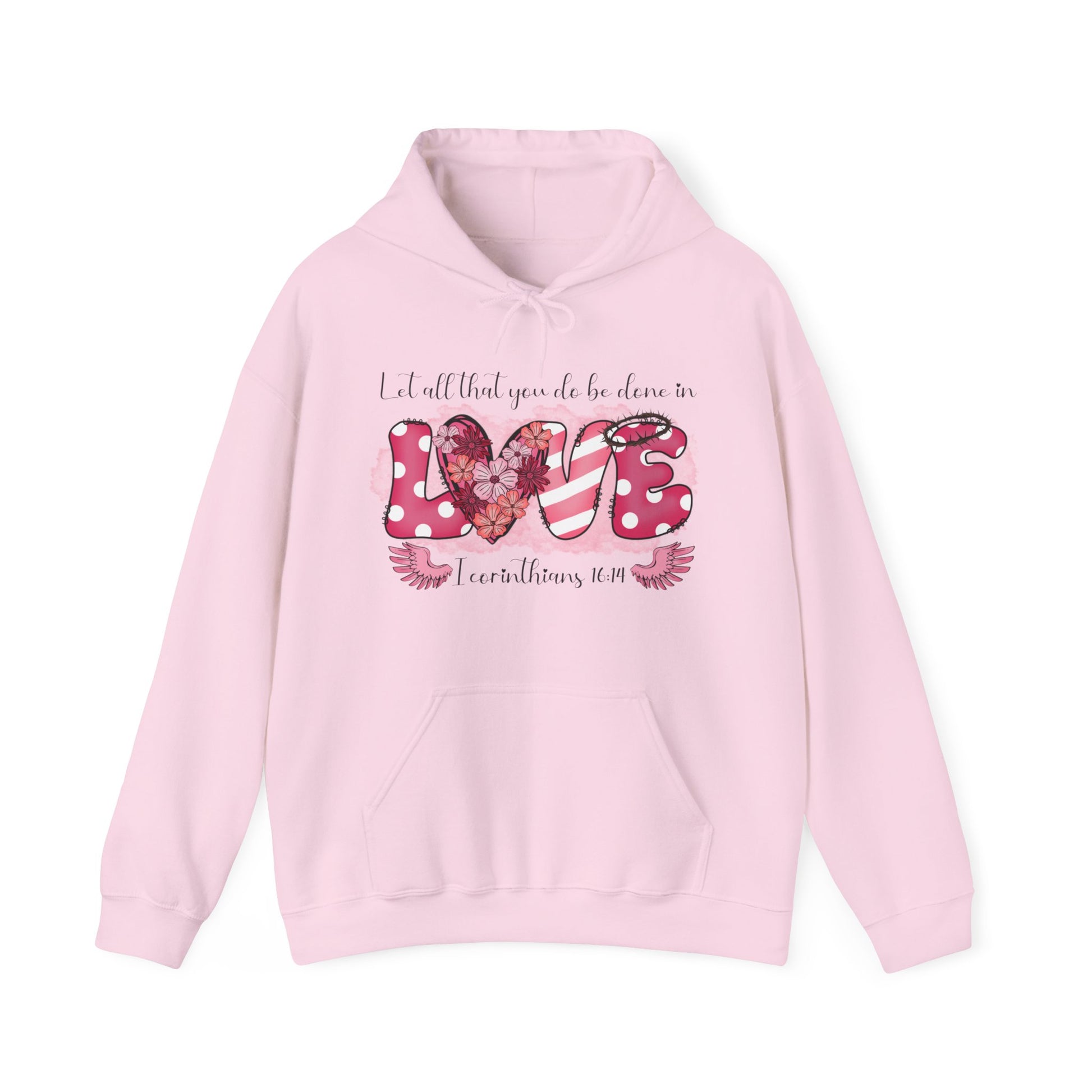 Light pink hoodie with a playful and fun front "Love" graphic.  The word love is represent by white polka dots with pick back ground on the L and E and the E has a thorn crown.  The V is pink and white stripes and the O is represented by a heart filled with flowers.  Above in scripts says "Let all that you do be done in" and below the word love are wings flanking either side of I Corinthians 16:14.