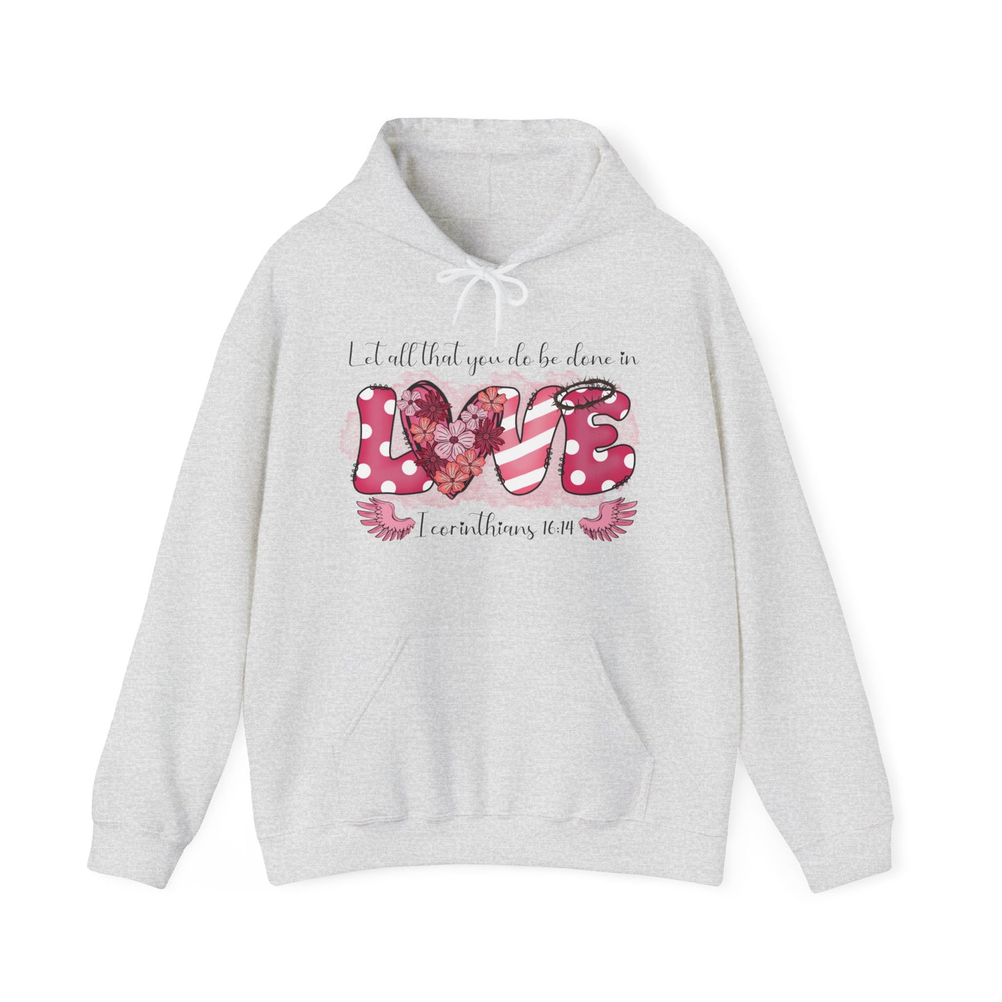 Ash colored hoodie with a playful and fun front "Love" graphic.  The word love is represent by white polka dots with pick back ground on the L and E and the E has a thorn crown.  The V is pink and white stripes and the O is represented by a heart filled with flowers.  Above in scripts says "Let all that you do be done in" and below the word love are wings flanking either side of I Corinthians 16:14.