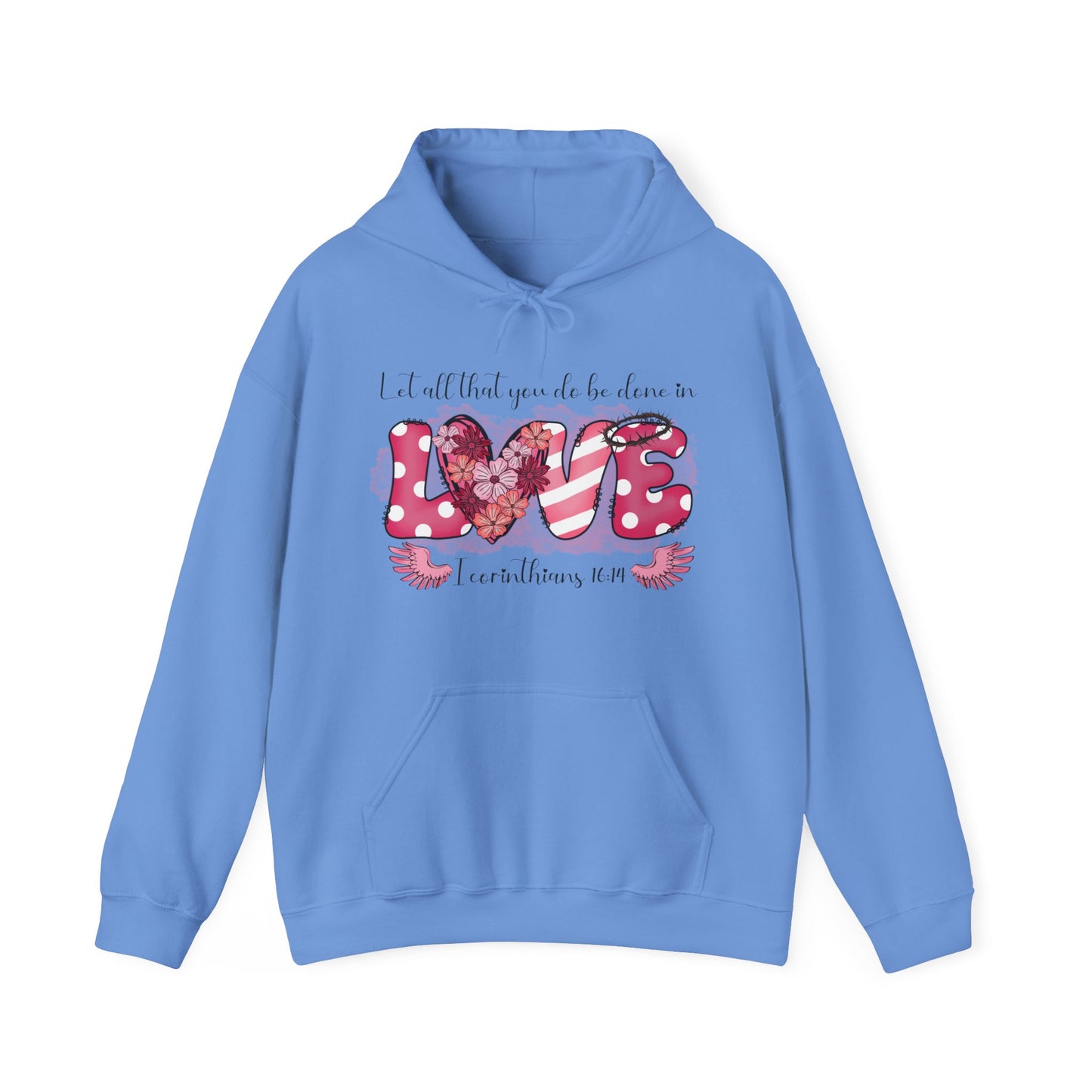 Carolina Blue hoodie with a playful and fun front "Love" graphic.  The word love is represent by white polka dots with pick back ground on the L and E and the E has a thorn crown.  The V is pink and white stripes and the O is represented by a heart filled with flowers.  Above in scripts says "Let all that you do be done in" and below the word love are wings flanking either side of I Corinthians 16:14.