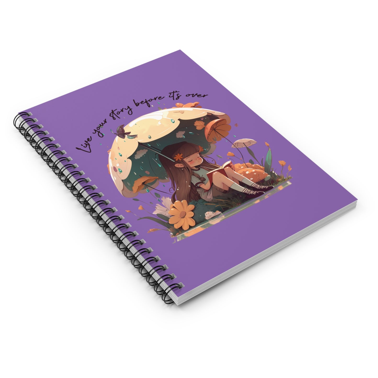 Spiral notebook with girl sitting under an umbrella reading a book in the rain surrounded by flowers and mushrooms with the words live your story before it's over arching above the umbrella