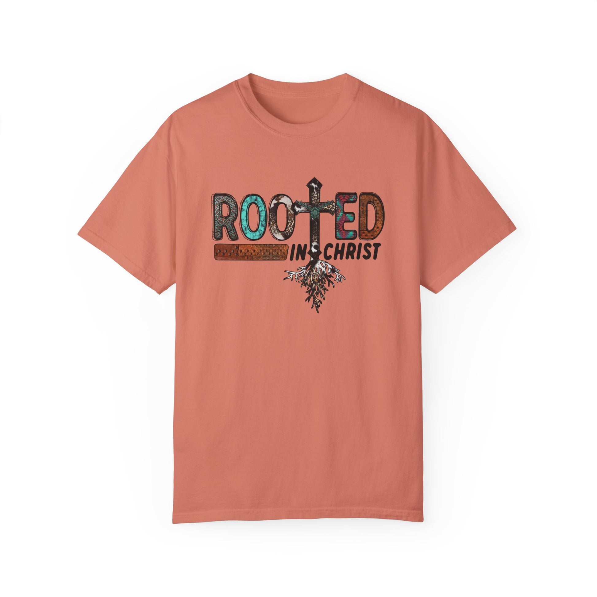 Terracotta colored T-shirt with the words Rooted in Christ across the chest with roots growing out of the T in the word rooted represented by a cross