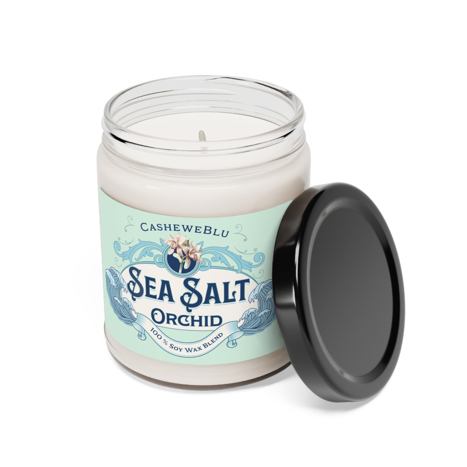 Sea Salt Orchid 9 oz soy candle with lid leaning on jar