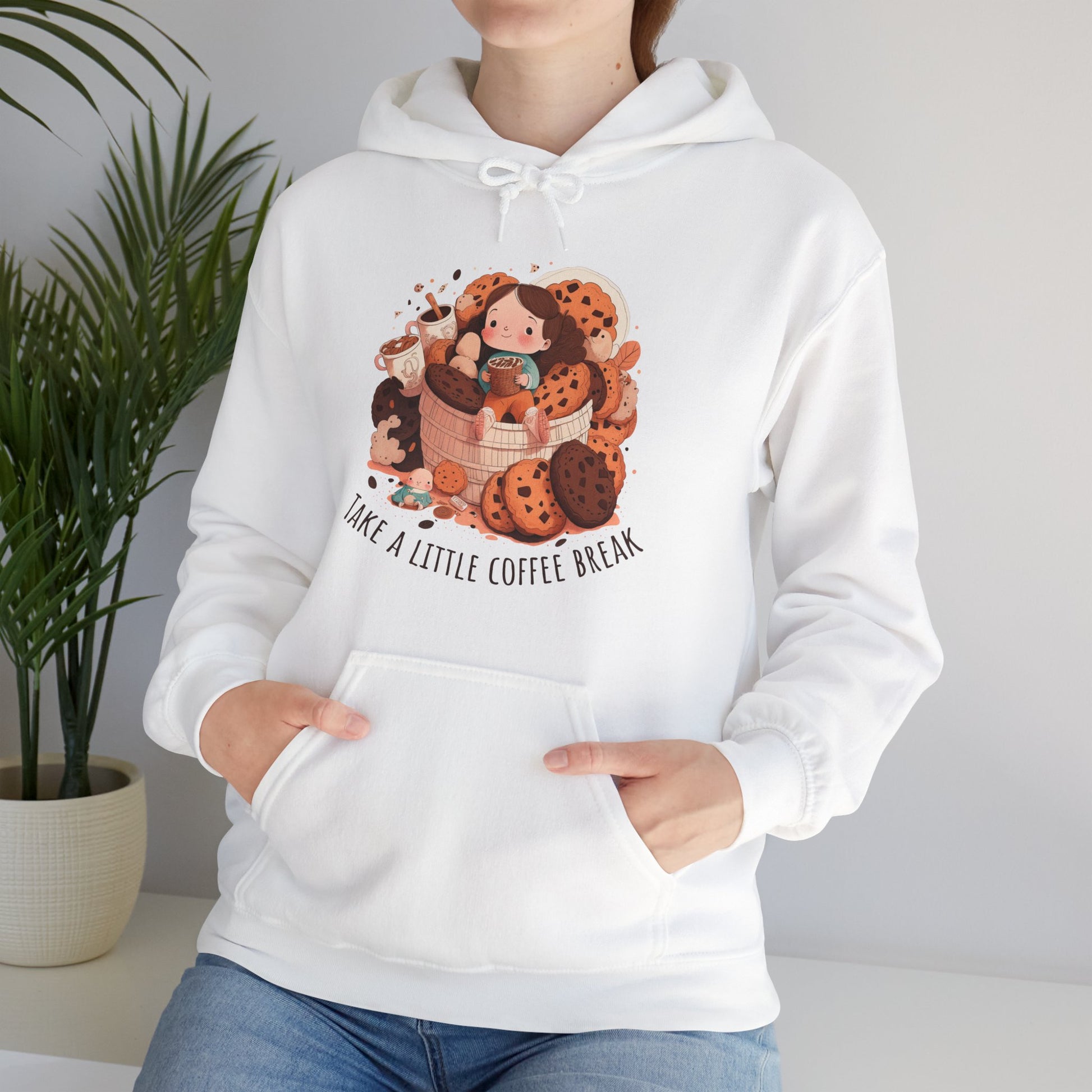 White colored hooded shirt with front graphic.  Cute girl sitting on a basket of cookies holding coffee with two other coffees on one side.  Underneath in an upward curve says "Take a Little Coffee Break".  Back of sweatshirt is plain - no graphic. Woman Model